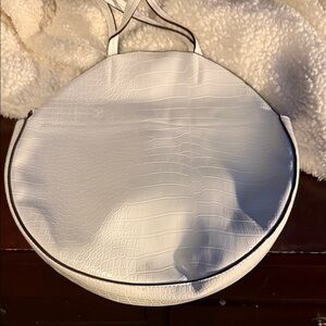 Women’s white round leather purse with straps